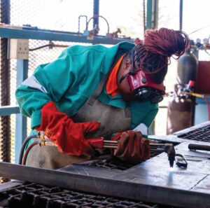 A female student participates in welding training, an outcome of Kansanshi’sinclusive skills development agenda.