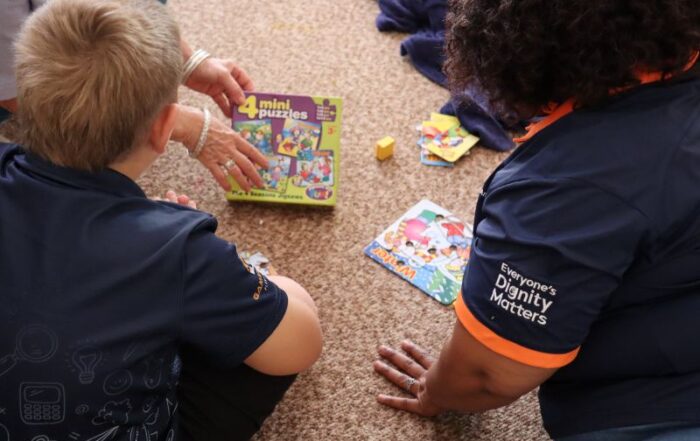 WiM member interacting with a Sprout Academy Learner.
